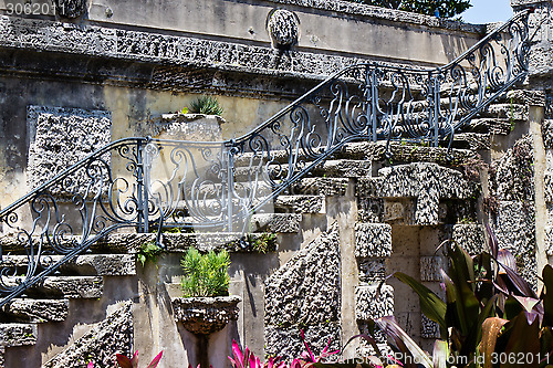Image of Old, ornate staircase with flowers