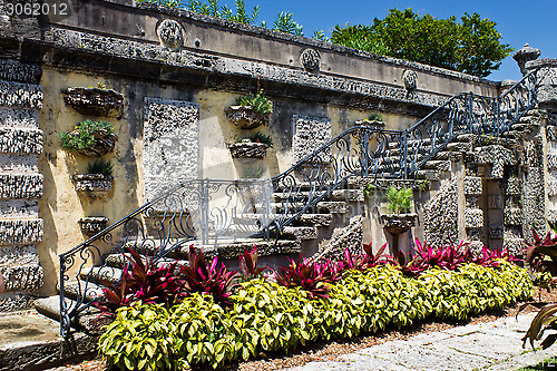 Image of Old, ornate staircase with flowers