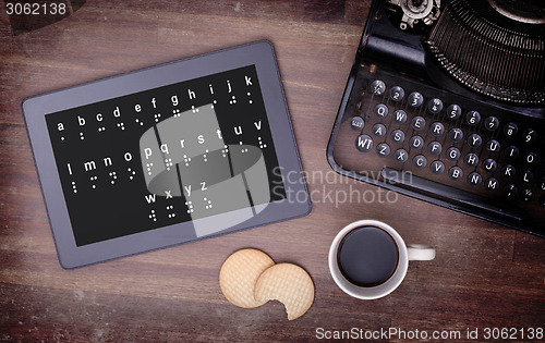 Image of Braille on a tablet, concept of impossibility
