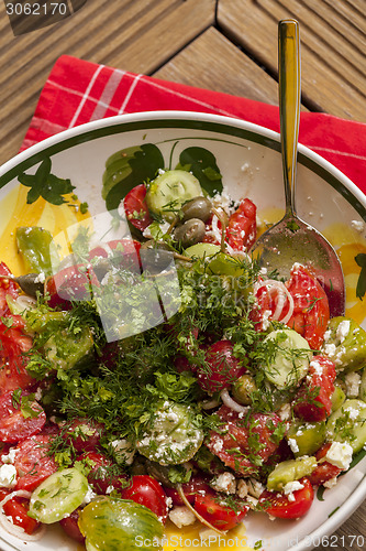 Image of Bowl of Marinated Greek Salad with Red Napkin