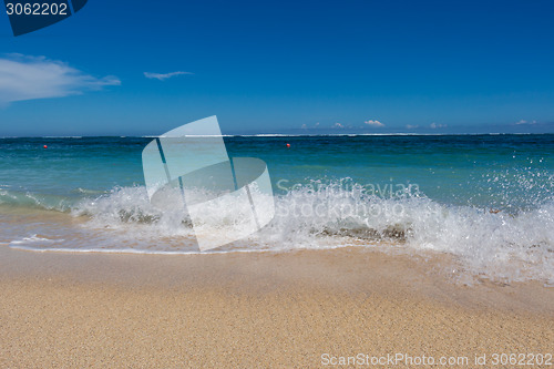 Image of Beautiful tropical beach with lush vegetation