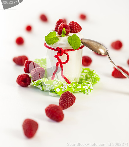 Image of Raspberries and yoghurt or clotted cream