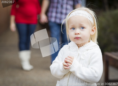 Image of Adorable Little Girl with Her Mommy and Daddy Portrait