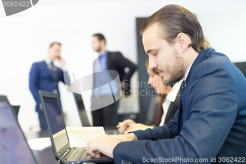 Image of Business people in modern office.