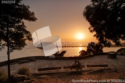 Image of Lovers enjoy the sunrise over Pittwater Palm Beach