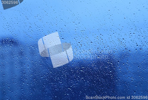 Image of Natural water drops on glass