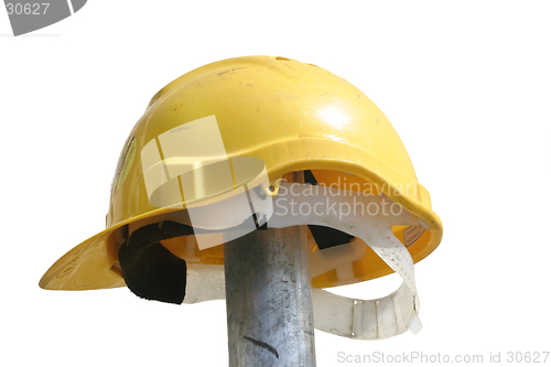 Image of Hard hat resting on a  pole