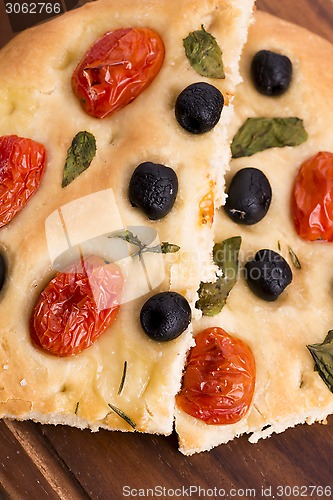 Image of Focaccia with black olives, tomatoes and basil