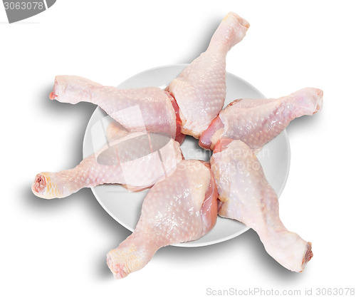 Image of Raw Chicken Legs As A Star On White Plate