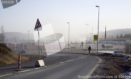 Image of walking by a dusty road