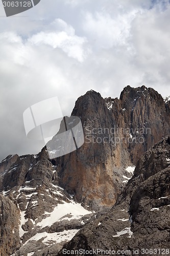 Image of Rocks with snow and cloudy sky