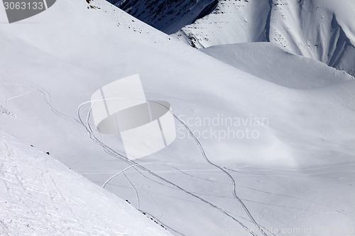 Image of View on snowy off piste slope with trace from ski and snowboards