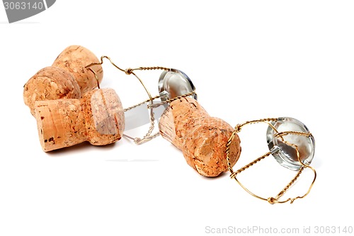 Image of Three champagne wine corks and muselets 