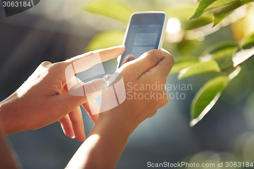 Image of Hands with smartphone