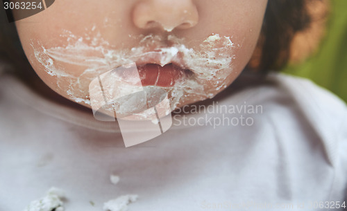 Image of Baby with dirty mouth after eating