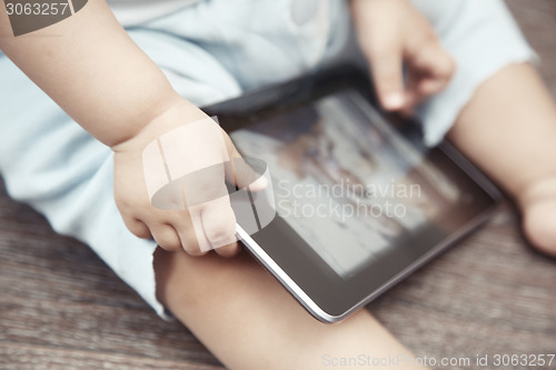 Image of Baby with tablet computer