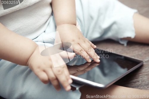 Image of Baby with tablet computer