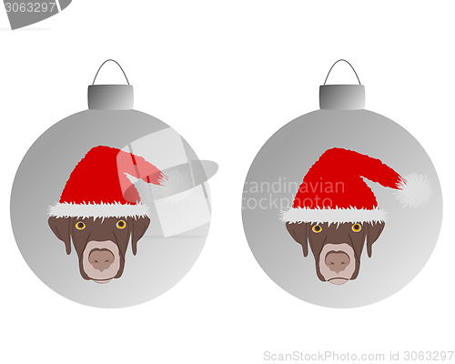 Image of Laughing dog with red santa claus caps on christmas bauble