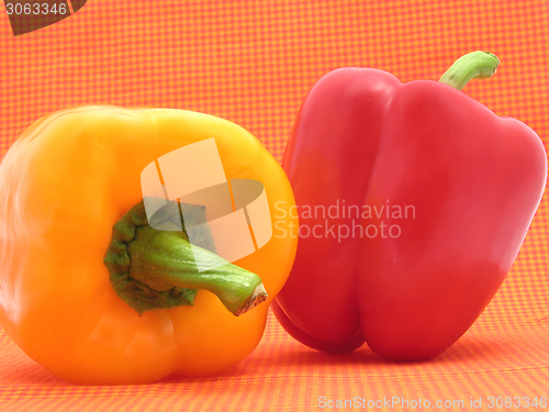 Image of Red and yellow pepper isolated on checkered background