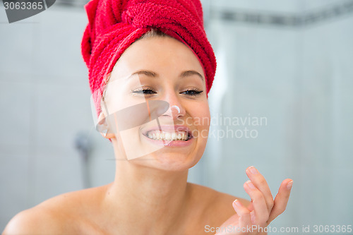 Image of Girl in front of the mirror