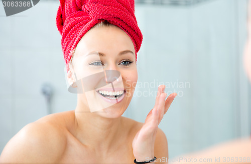 Image of Girl in front of the mirror