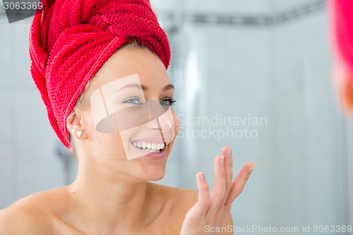 Image of Girl in front of the mirror