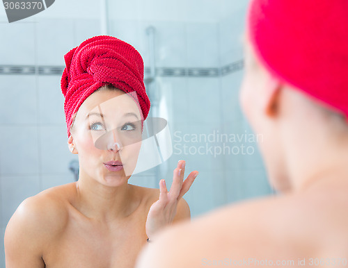 Image of Girl in front of the mirror