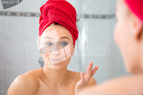 Image of Girl in front of the mirror