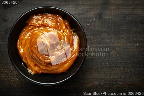 Image of Bowl of melted caramel cream