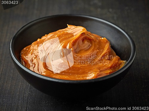 Image of Bowl of melted caramel cream