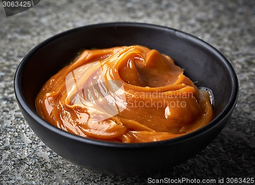 Image of Bowl of melted caramel cream