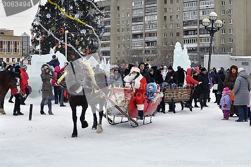 Image of Festive drivings on sledge with Father Frost.