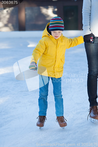 Image of family ice skating