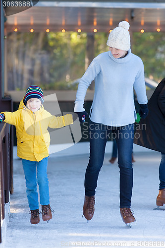 Image of family ice skating