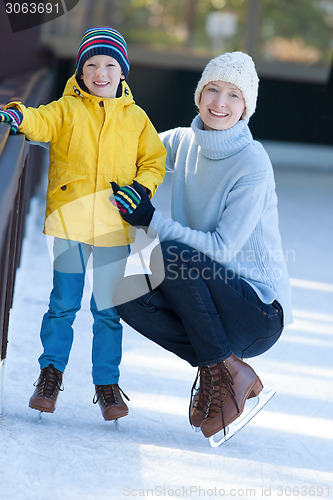 Image of family ice skating