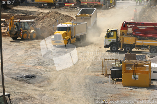 Image of Trucks rumble into a construction site