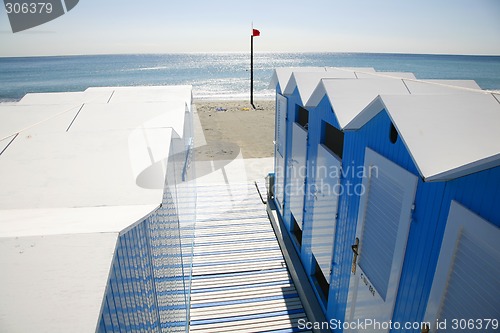 Image of Blue beach huts.