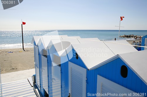 Image of Blue beach huts.