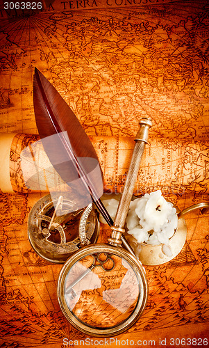 Image of Vintage still life. Vintage items on ancient map.