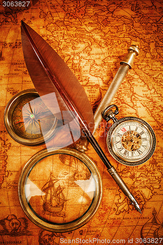 Image of Vintage still life. Vintage items on ancient map.