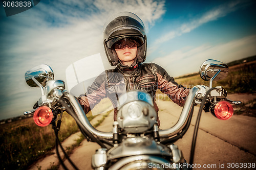 Image of Biker girl on a motorcycle