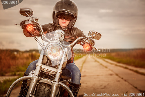 Image of Biker girl on a motorcycle