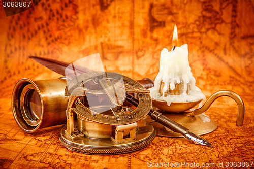 Image of Vintage still life. Vintage items on ancient map.