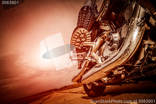 Image of Biker girl riding on a motorcycle