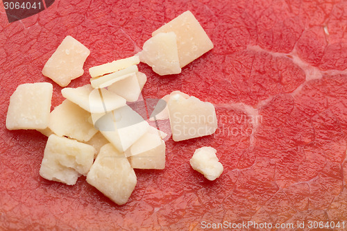 Image of cheese on a background of meat