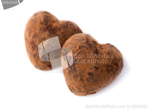 Image of Two candy truffle heart shaped. Symbols of Valentine's Day.