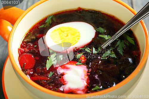 Image of Beetroot soup with egg and sour cream.