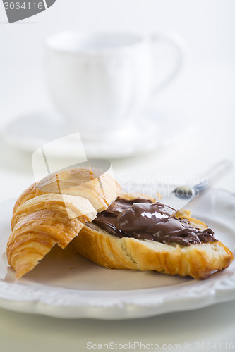 Image of Breakfast with croissant and chocolate.