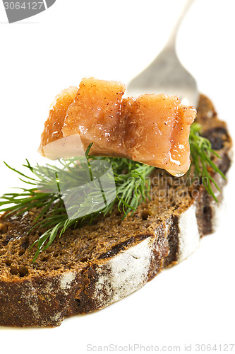 Image of Slice of herring and black bread.