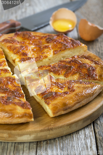 Image of Slices of pie with cheese.